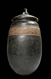 A Tall Lozi Carved Wooden Container Field Collected: A very finely crafted and uncommon tall cylindrical lidded container with incised linear designs and fitted lid. Lozi Peoples, Zambia, Africa. The Lidded vessel measures 19 x 10 inches. Provenance: