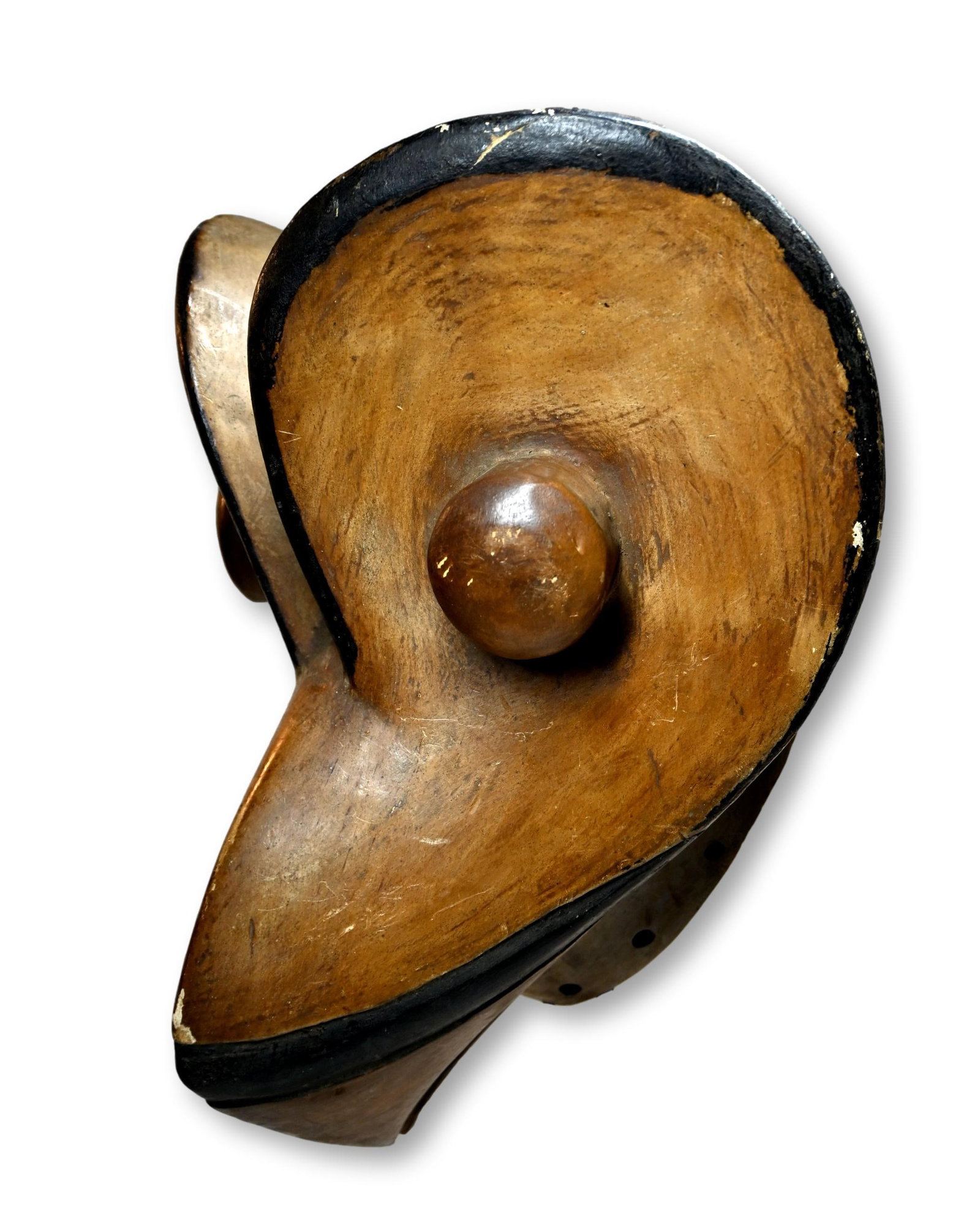 A Bird Mask from the Ivory Coast: A carved wood and painted bird effigy mask with a highly stylized avian style face and form. The mask measures 13 x 10.5 inches.