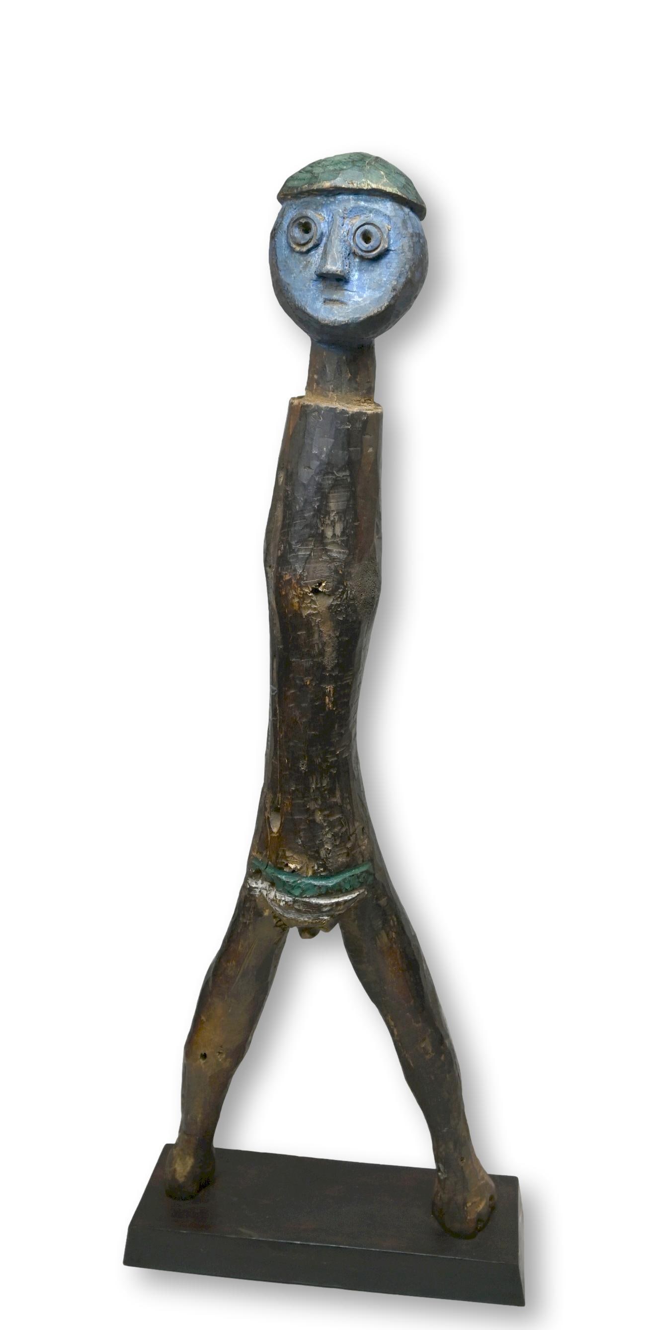Wonderful Abstract Tanzania Sculpture: A Tall carved wooden shrine like idol with painted features and some signs of wear and weathering. Sukuma or related ethnic group, Tanzania, Africa. The sculpture has been custom mounted and measures 