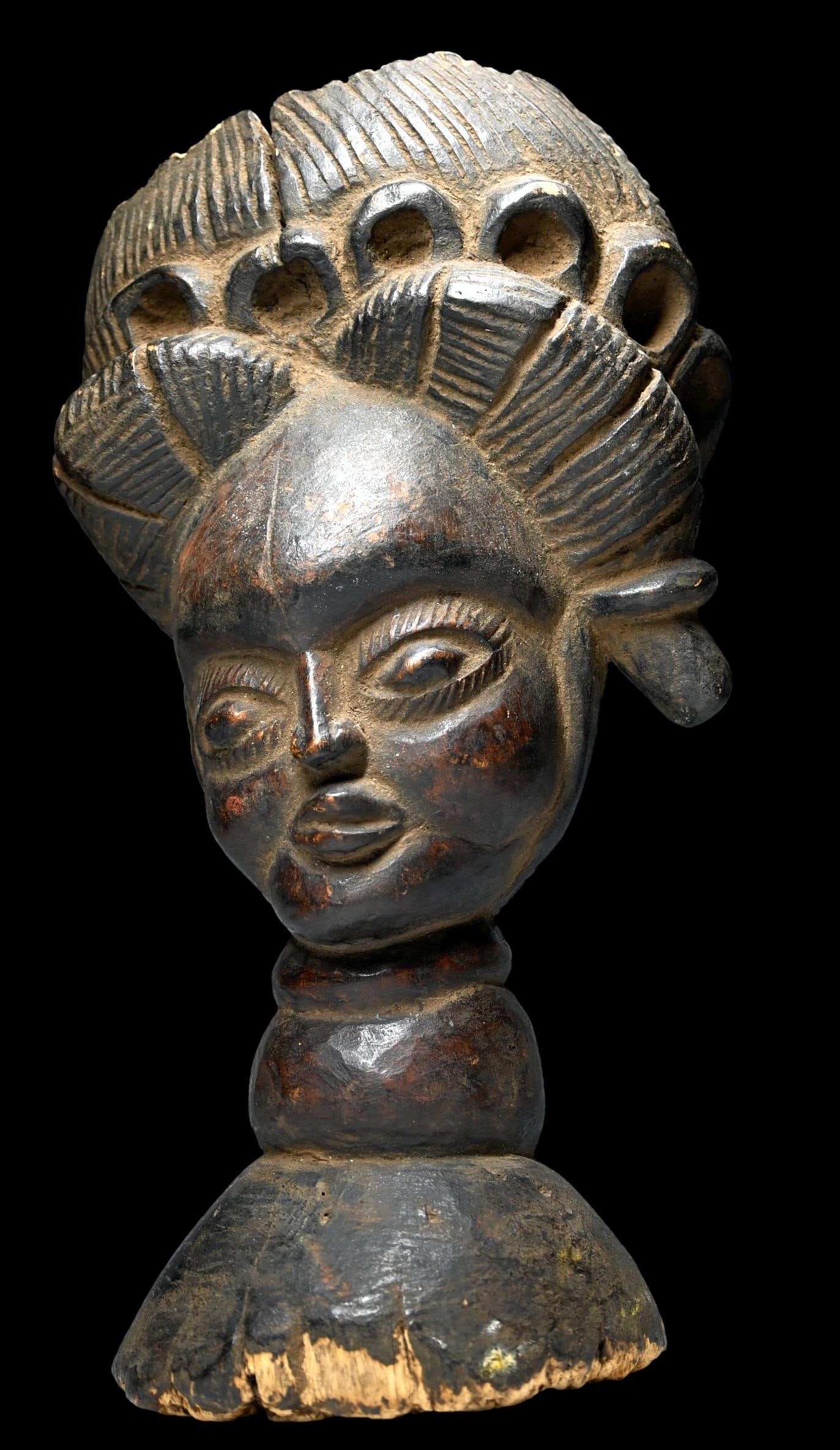 A Temne Carved Bust: Old and eroded carved wooden bust from the Temne peoples, Sierra Leone, West Africa ( likely early 20th Century.) The Temne people also utilize practices of a secret society which aims at gradually bu