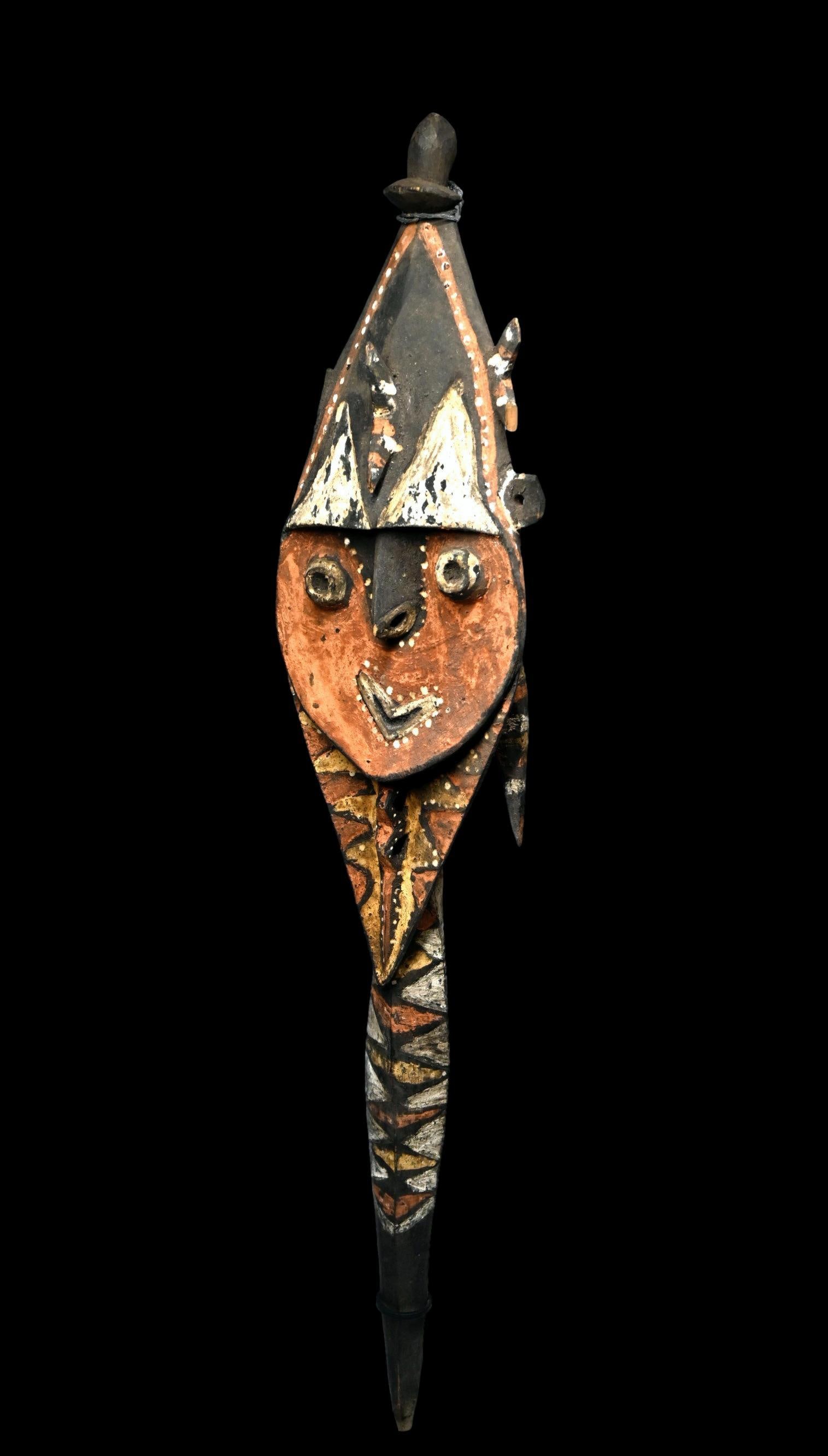 A Yena Yam Spirit Effigy: A Colorful old Yena Sculpture, Kwoma Washkuk, east Sepik Province, Papua New Guinea. Carved from wood and painted with red,yellow, black and white pigments. Considered a supernaturally powerful food,