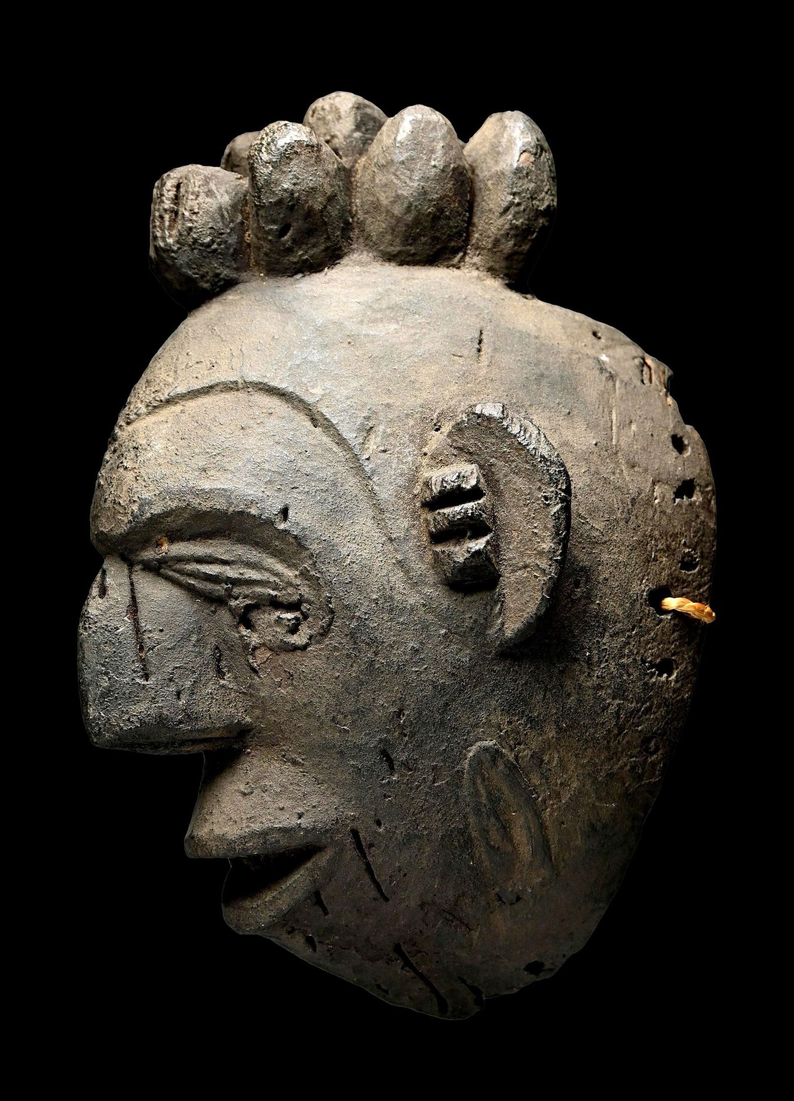 Idoma Ceremonial Africa Mask: A carved wood field used example of a ceremonial mask with a highly stylized form and a weathered and encrusted surface. Such masks were worn in front of a basketry style mask along with a thick fiber