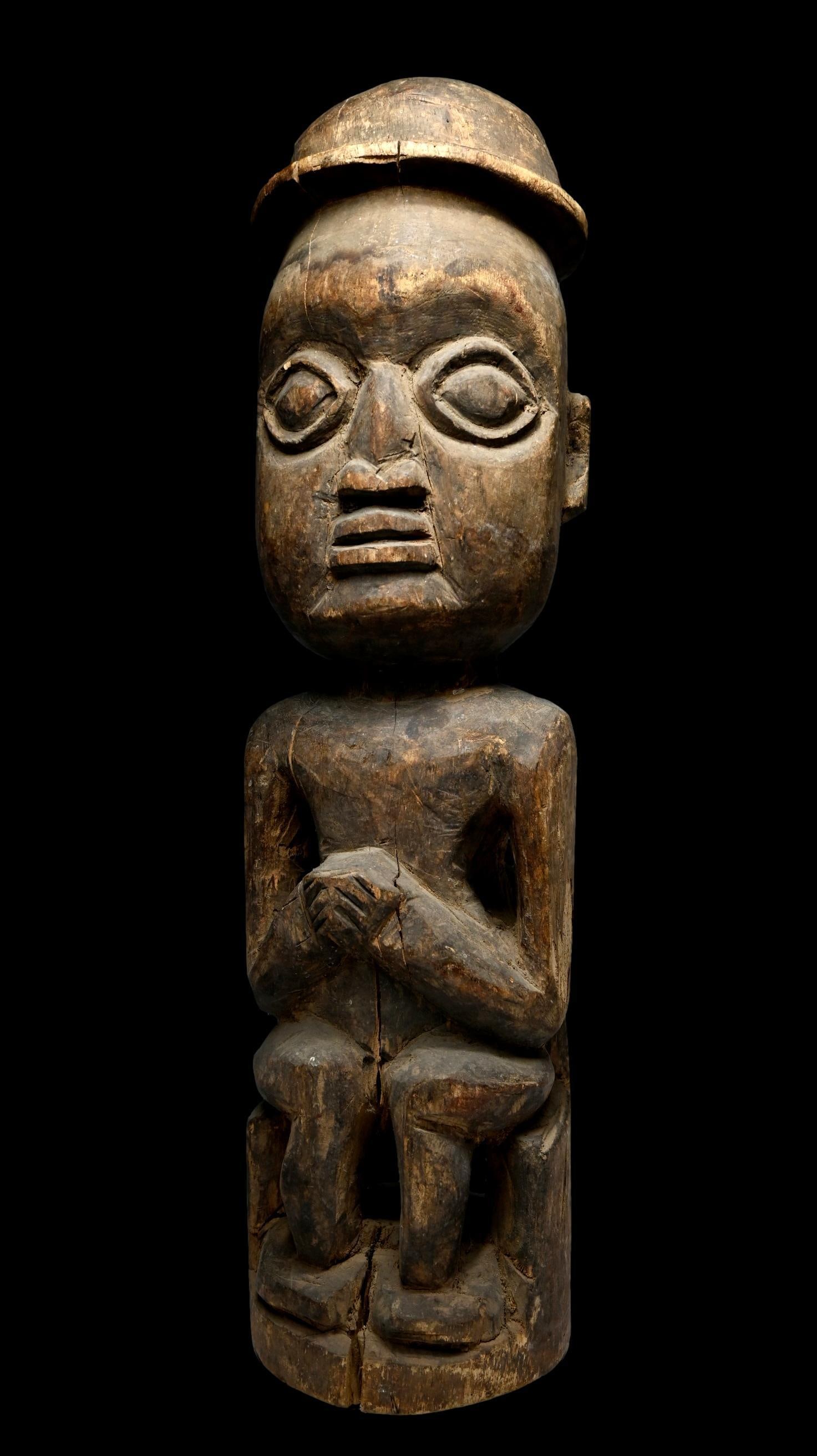 A Folk Art Yoruba Sculpture: A primitive Folk art style sculpture with age and handling. Yoruba peoples, Nigeria, West Africa. The sculpture measures 25 inches tall. Provenance: Ex Karl Stirner collection, Easton, PA.