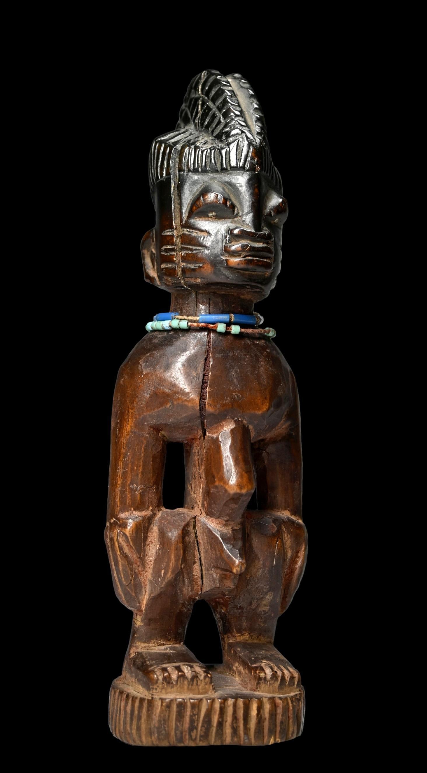 A Yoruba Male Twin Figure (1 of 6)