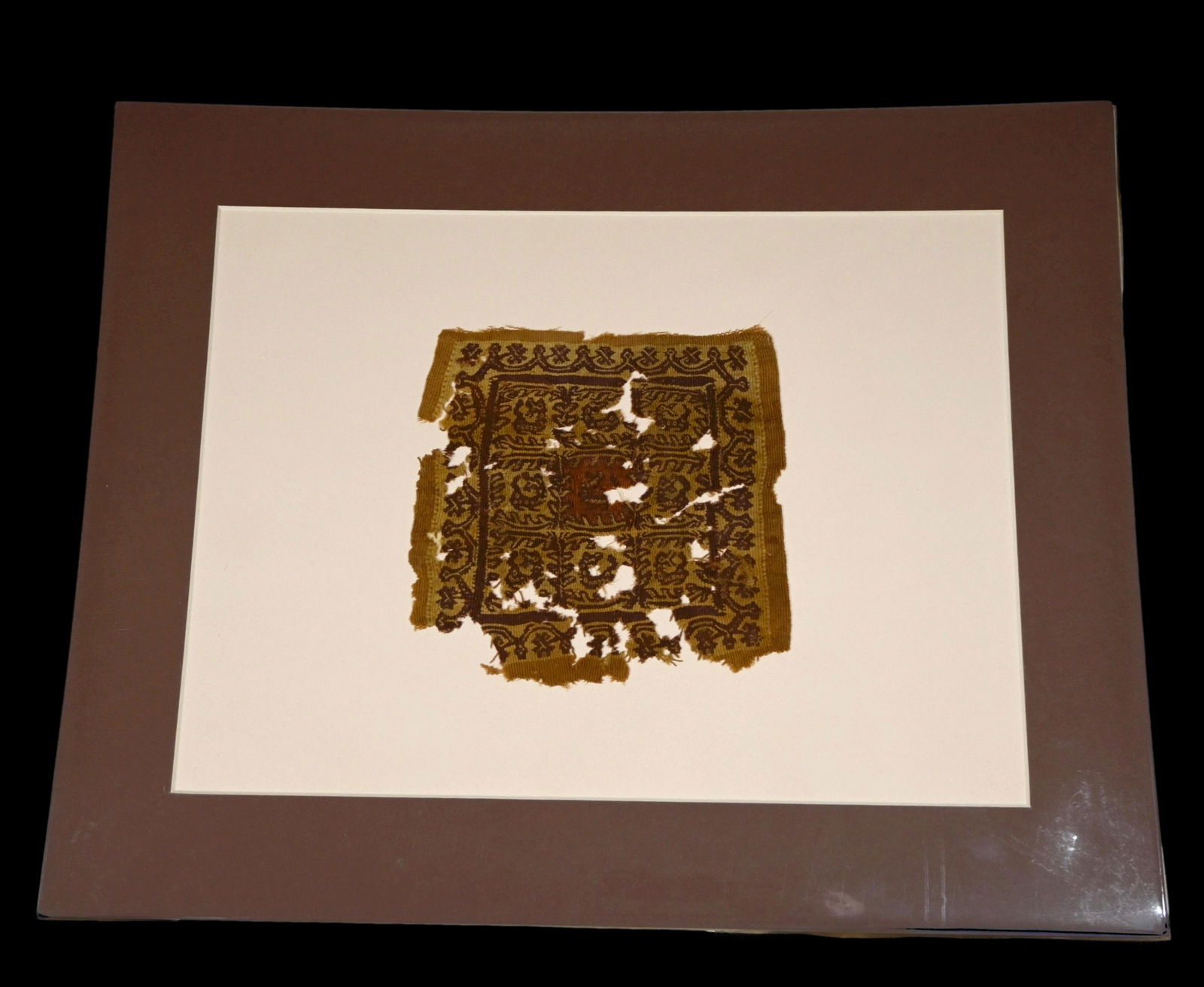 Ancient Coptic Textile With Crocodile Motif: A rare large fragmented section of an ancient textile dating from the 3rd-10th century, Egypt and the Coptic peoples. The fragment features beautiful brown, red and gold colors and what appear to be