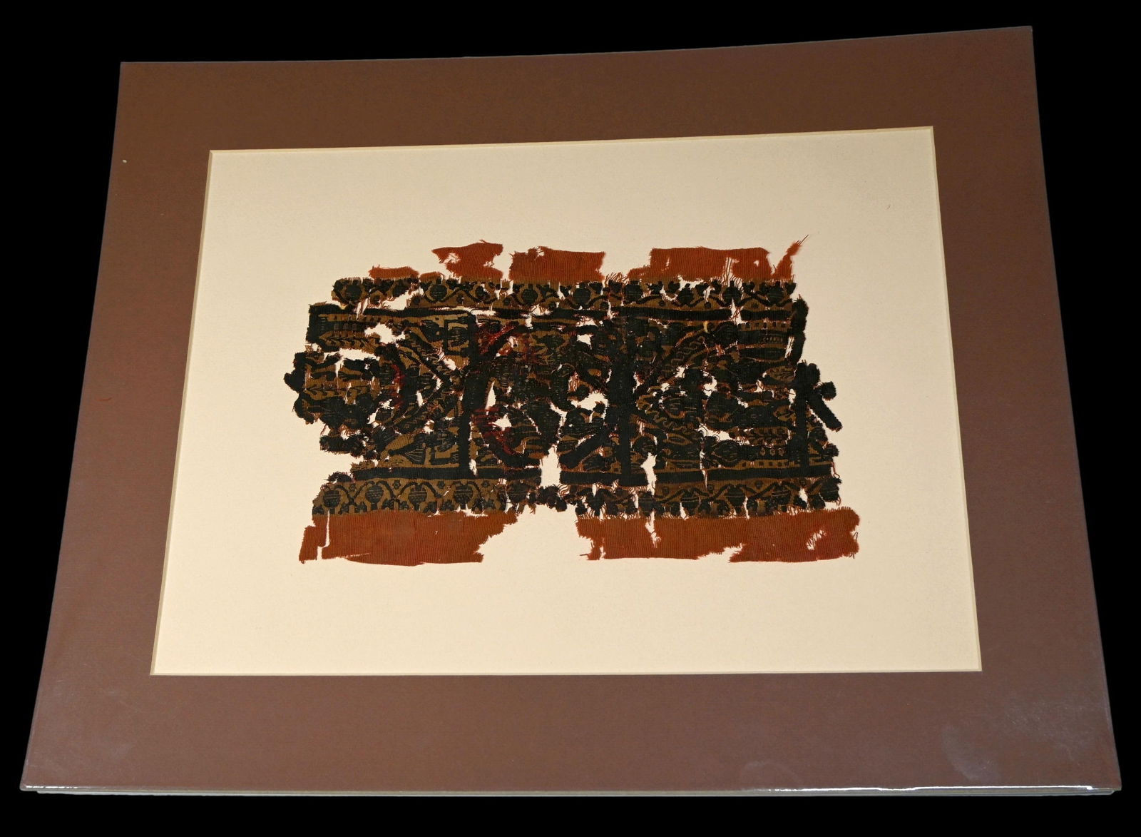 3rd-10th Century Coptic Textile with Mermaid Motif: A rare large fragmented section of an ancient textile dating from the 3rd-10th century, Egypt and the Coptic peoples. The fragment features beautiful brown, red and black colors and what appear to be