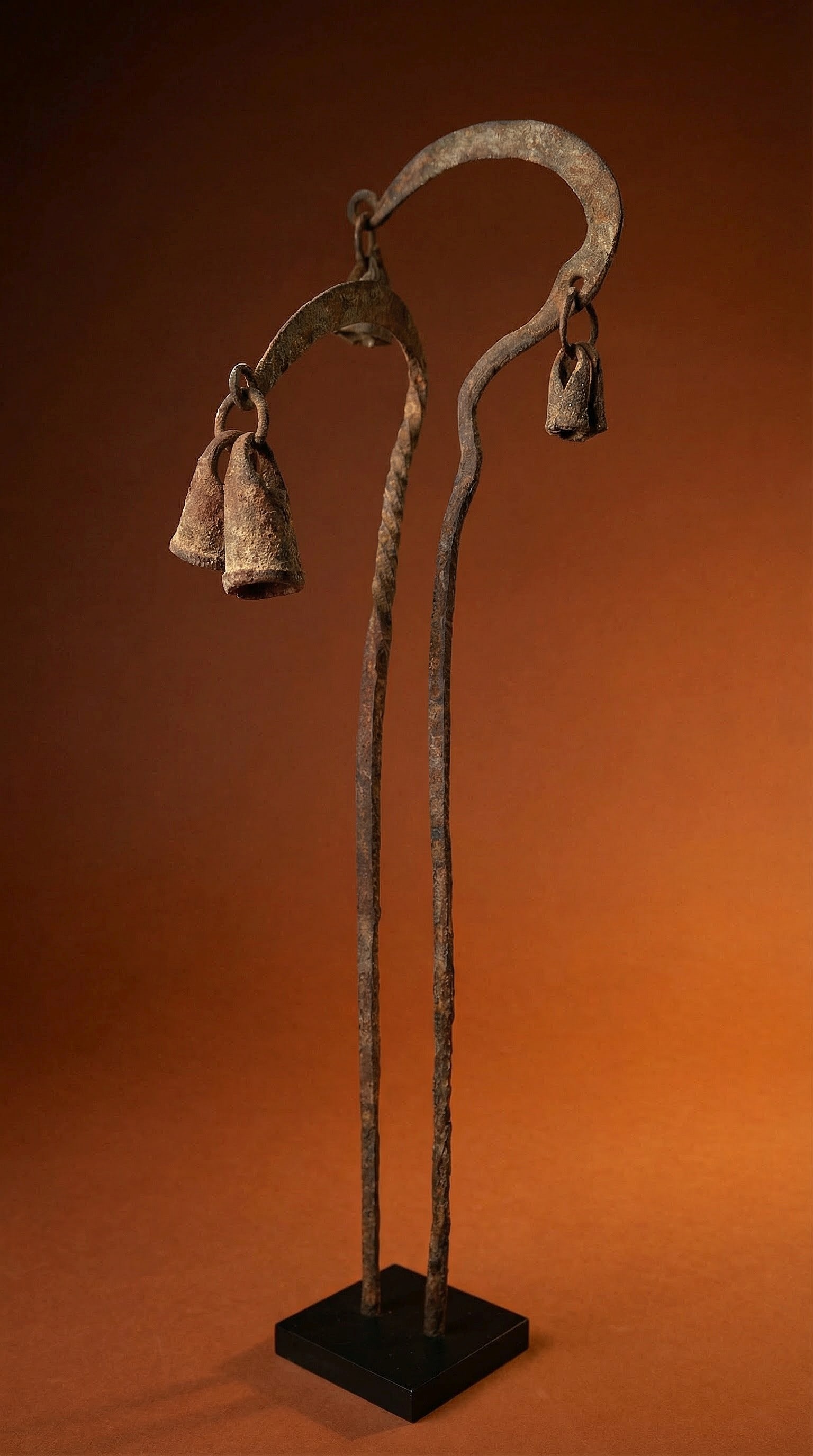 A Pair of Dogon Ritual Iron Staff: A very old, likely late 19th or early 20th century pair of wrought iron ceremonial staff adorned with two iron bells. Dogon peoples, Mali, West Africa. The pair of staff measures 18 and 16 inches