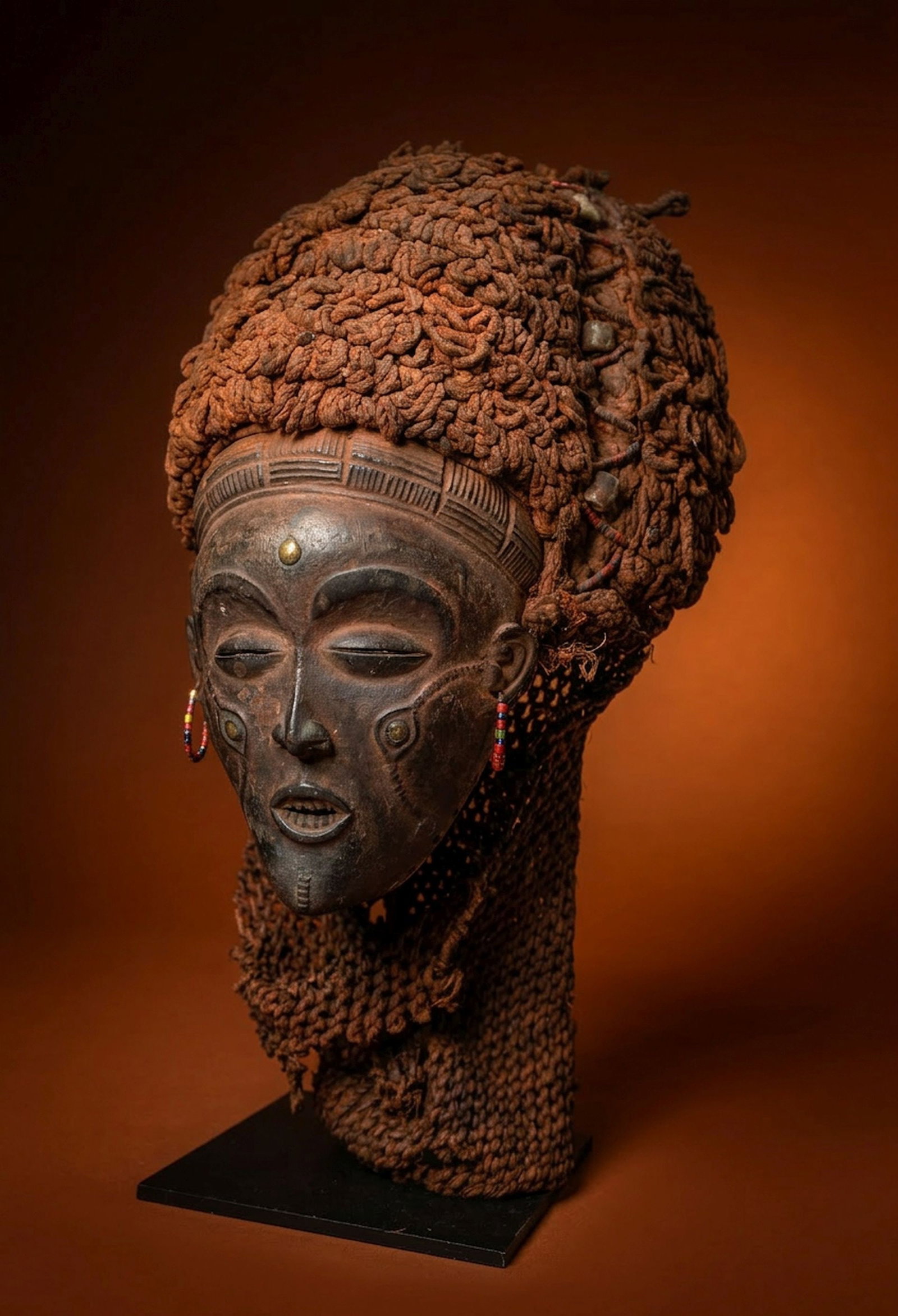 A Chokwe Pwo Mask: A beautiful old ceremonial mask, honoring founding female ancestors and idealizing feminine beauty, fertility, and social grace. Worn by men during initiation ceremonies and celebrations. This mask me