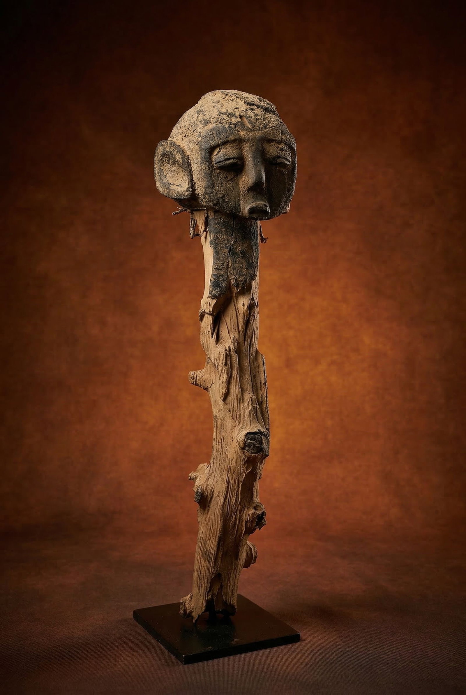 Fragmented Lobi Shrine Sculpture: A very old and well worn / weathered shrine sculpture , though only the head remains, the rest of the sculpture has eroded away. This was likely a Spike like carving planted into the ground to mark a