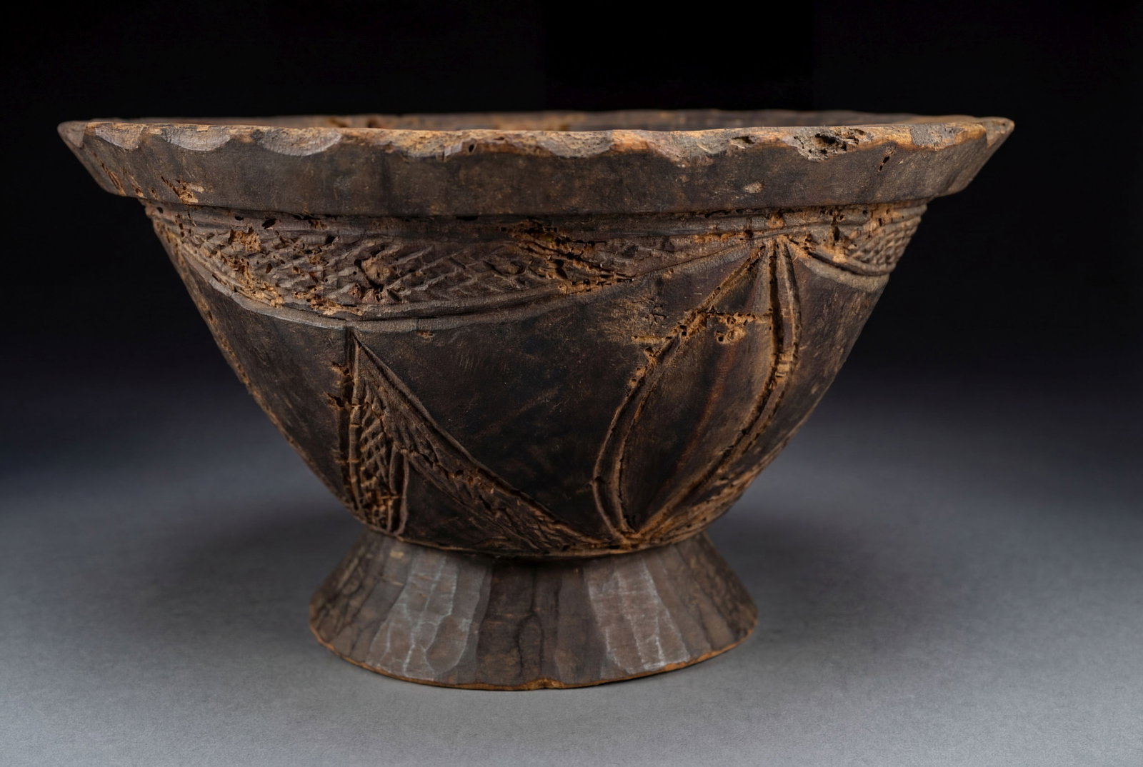 19th century Dan Food Bowl Baltimore Museum of Art 1968: A very old carved wooden utilitarian food bowl with various raised motif and scalloped edge. Dan peoples, Liberia, West Africa. The Bowl measures 13.5 inches across. Provenance: Ex Collection Frederic