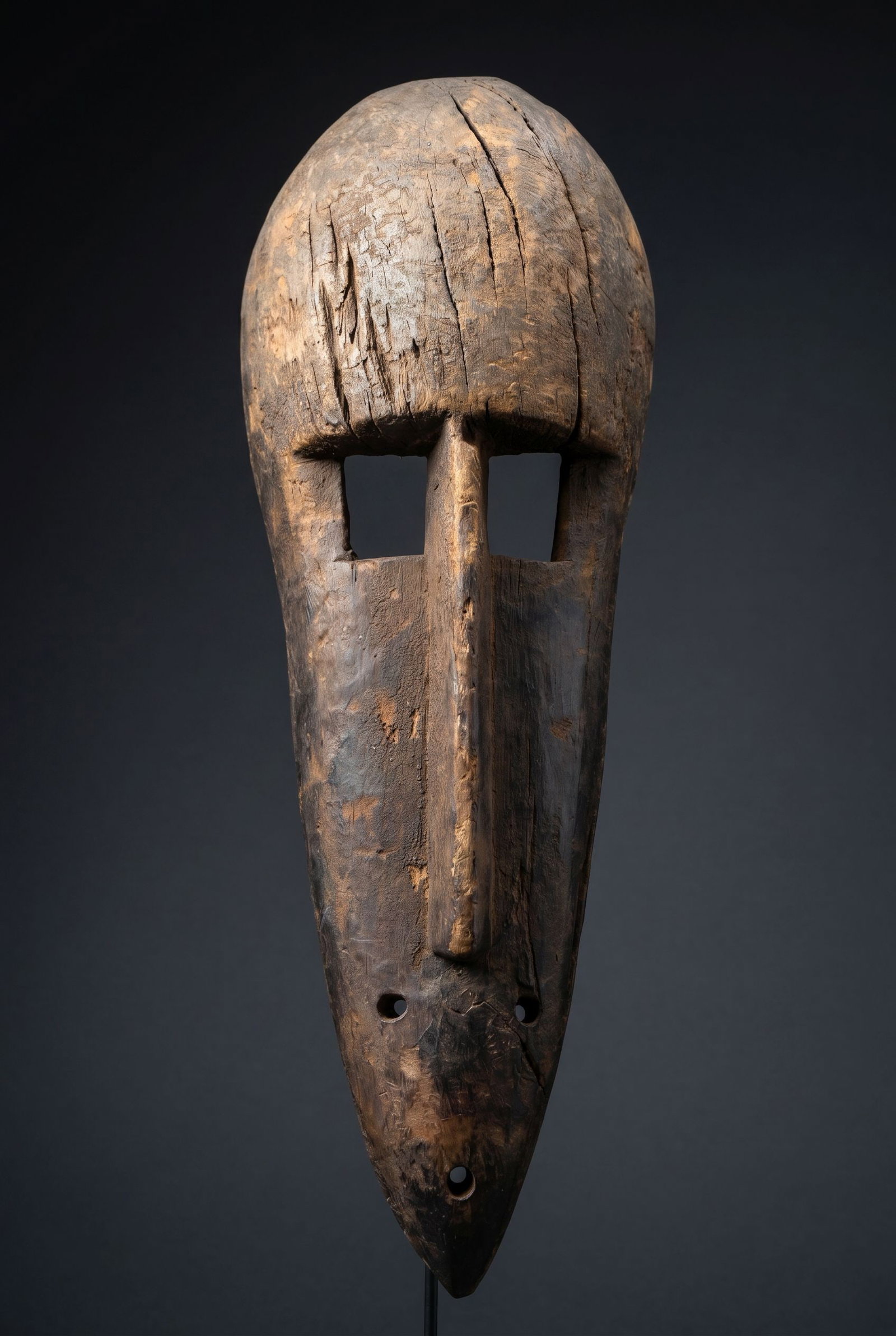 A Bamana Ngon Monkey Mask: A carved wooden mask in the form of the monkey (Ngon) which probably originates from the Koulikoro region at the centre of the Bamana country in Mali, West Africa. The mask has a well weathered surfac