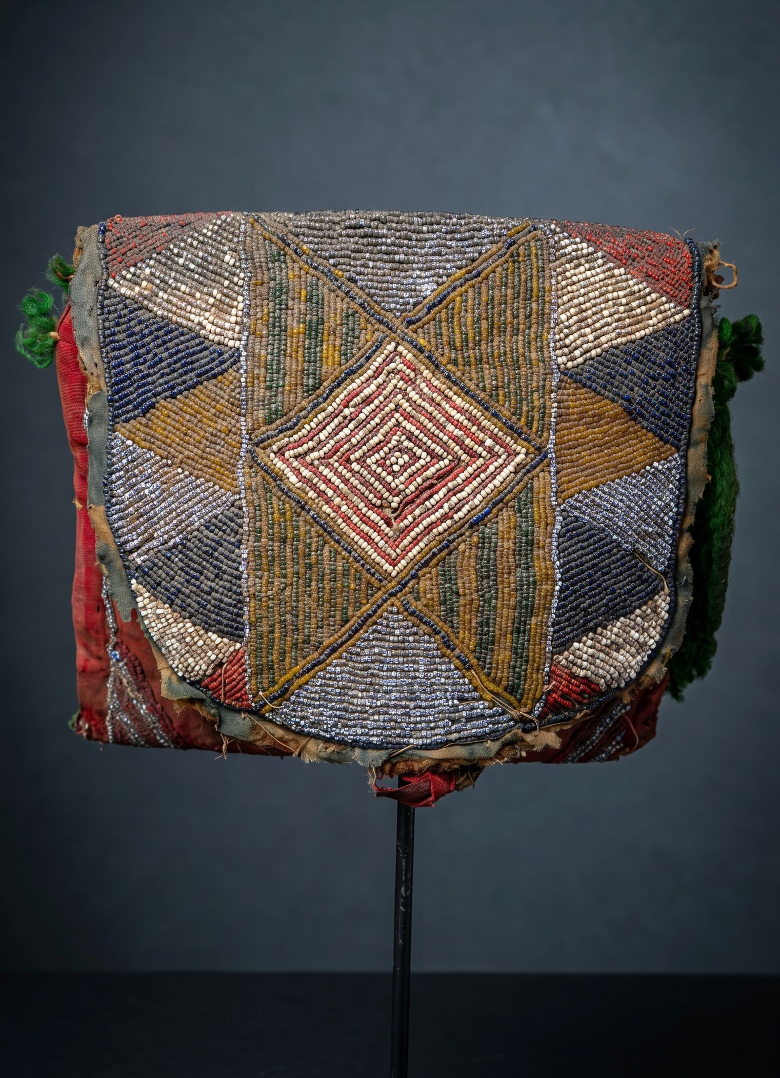 Old Yoruba Diviners Satchel Ex Charles Jones: This finely beaded Yoruba apo Ifa (divination bag), likely at late 19th to early 20th century example which served as an essential object within the practices of Ifa divination. Apo Ifa were used to h