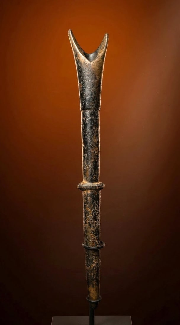 A Well Used Old Bwa Flute Ex Wheelock Collection: A carved wooden flute or whistle with a large open mouth piece and a traditional form, as well as an incredible patina suggesting generations of field use. Bwa or possibly Bobo peoples, Burkina Faso, 
