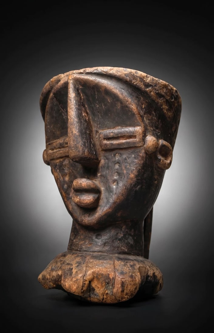 A 19th Century Lwalwa Medicine Mortar: A very rare example of a carved wooden mortar utilized by traditional doctors (diviners) as containers for preparing ritual medicines used to cure illnesses, protect the village, or ensure successful