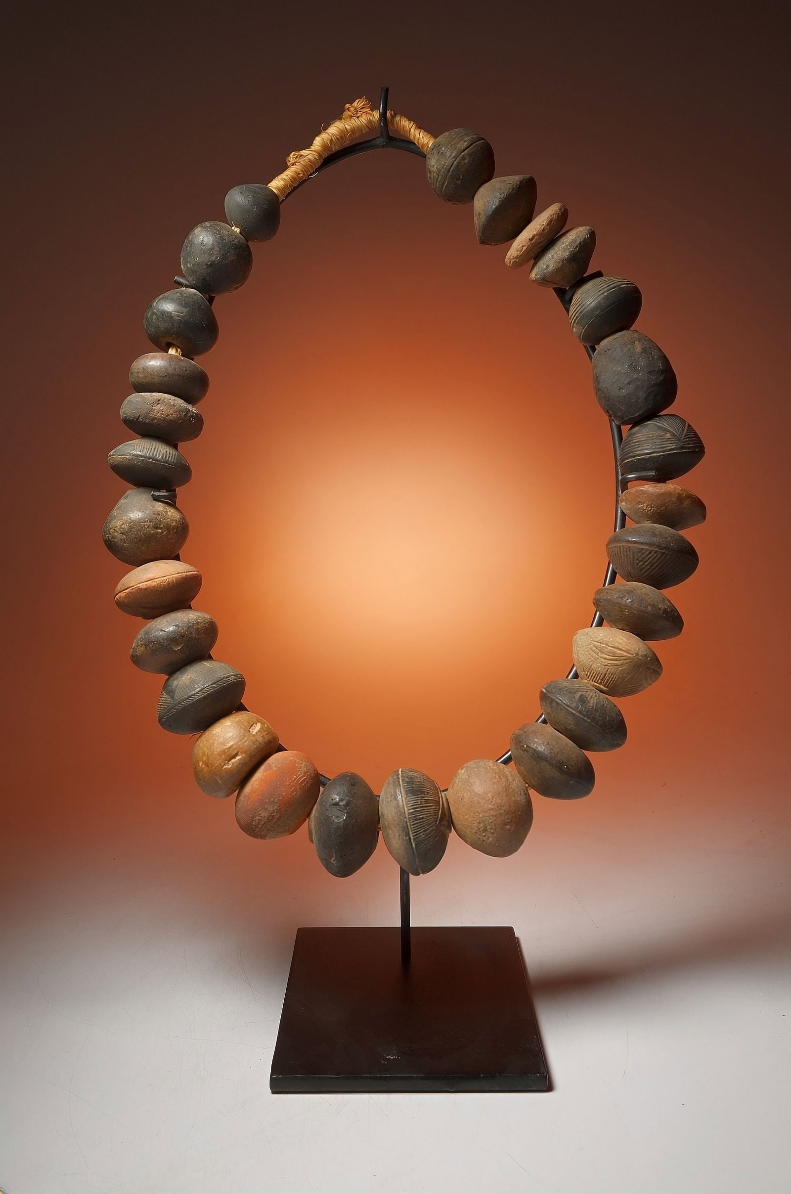 Necklace Of Ancient Clay Beads from Timbuktu: A strand of very large ancient spindle whorls, terracotta clay beads used on the weaving looms of ancient Djenne , Timbuktu, Mali, West Africa. Each bead is 800 to 1000 Years old, and this is the