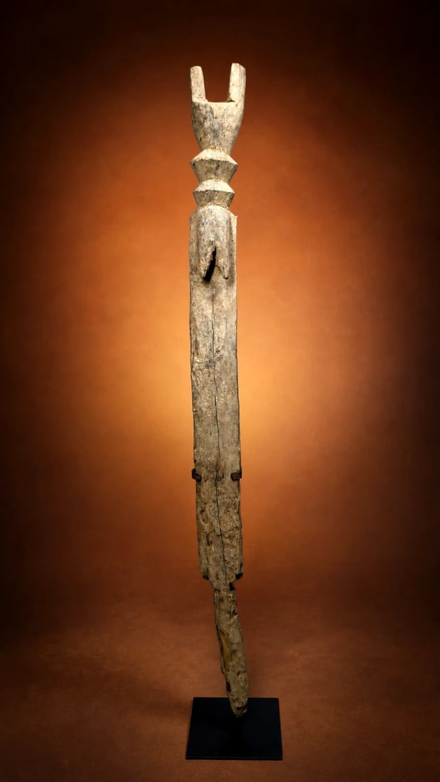A Dogon Sacred Shrine Post: A vintage and well worn sculpture of a post with female attributes. Such posts would likely designate sacred areas for worship and perhaps this was used on a fertility or ancestor shrine. Sacred objec