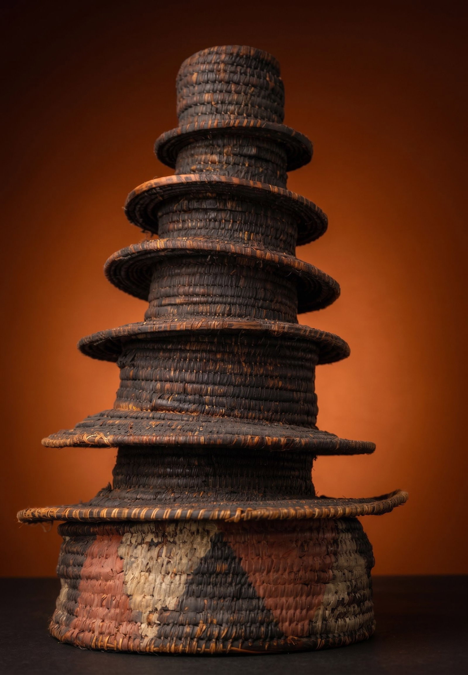 A Ekonda Prestige Hat or Botolo: Worn as part of his ceremonial attire, this striking, structural head adornment known as a Botolo, served as a visual signifier of the Ekonda chief's rank within his community. Within Ekonda society, 