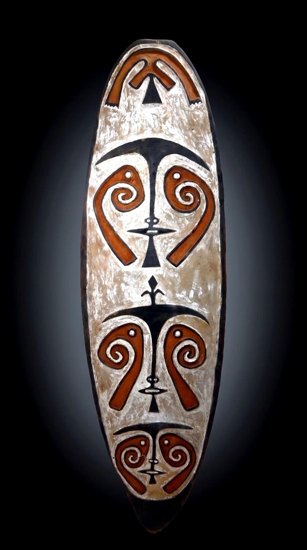 Old Kikori Spirit Board: A Kikori area spirit board (Gope); Gulf province Papua New Guinea. (C. 20th Century) A tall carved wooden panel of typical form for the type, the board in white with rust brown and black designs which