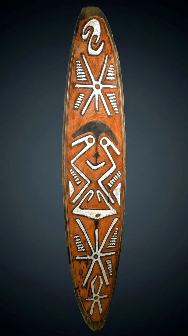 Old Wapo / Era River Spirit or Gope Board: A fine Wapo /Era region spirit board (Gope); Gulf province Papua New Guinea. (C. 20th Century). A tall carved wooden panel of typical form for the type, the board in rust brown, black and white, the u