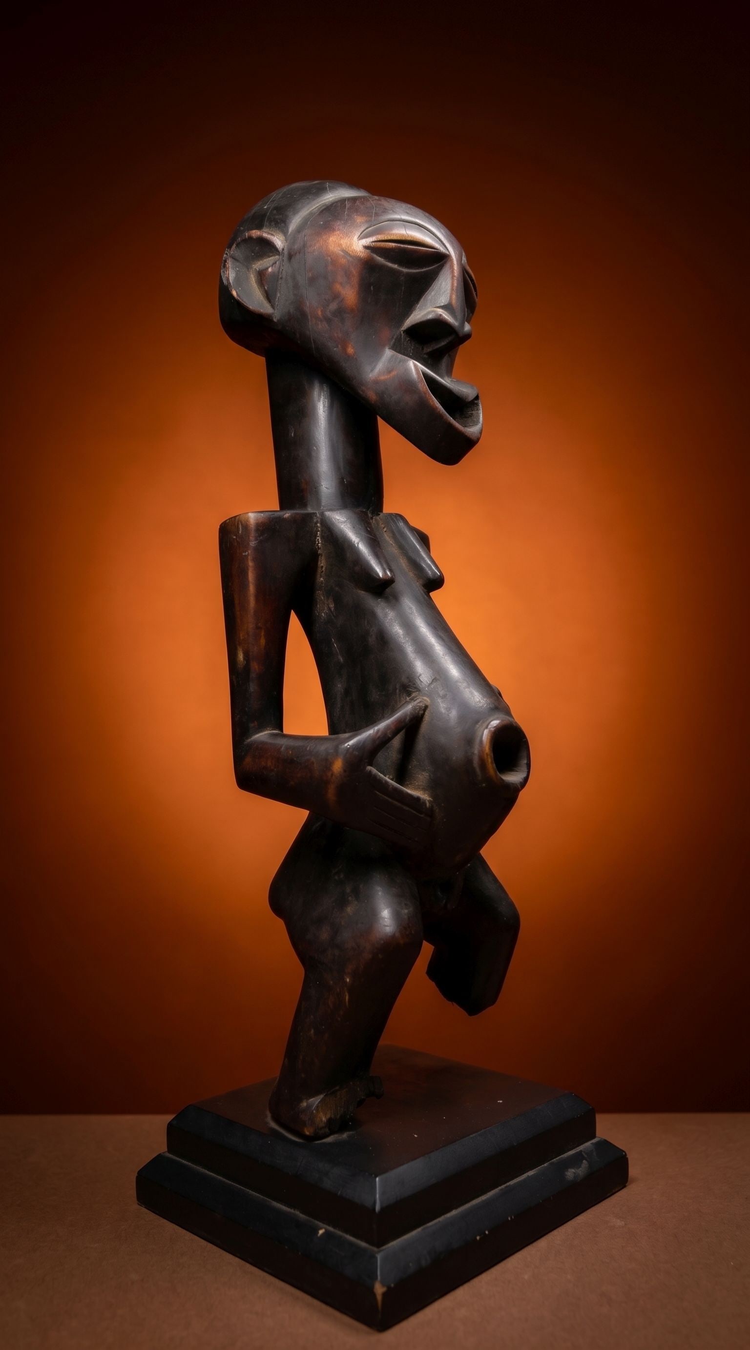 A Songye Female Sculpture: This is a carved wooden female effigy with classic facial features. This sculpture measures 23 x 6 inches. Songye peoples, DRC/ Congo, central Africa. Provenance: A private American collection, report