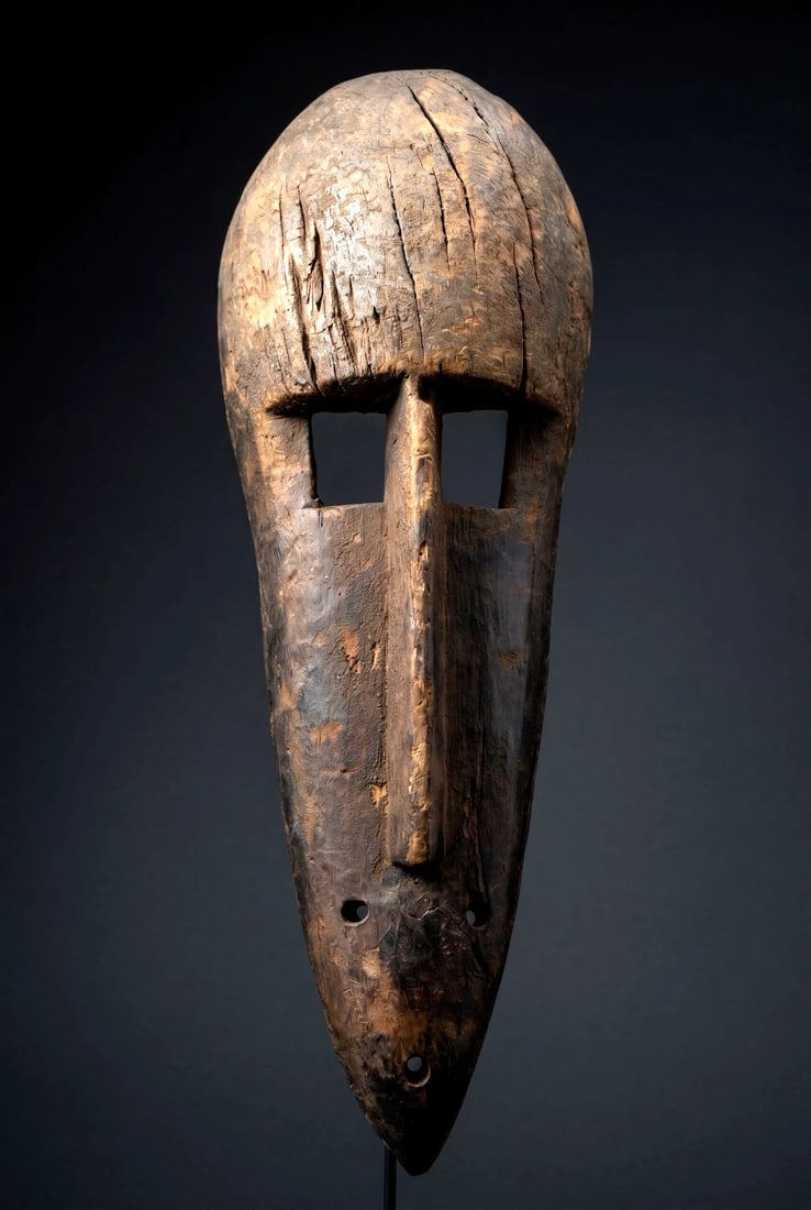 A Bamana Monkey Mask: A carved wooden mask in the form of the monkey (Ngon) which probably originates from the Koulikoro region at the centre of the Bamana country in Mali, West Africa. The mask has a well weathered surfac