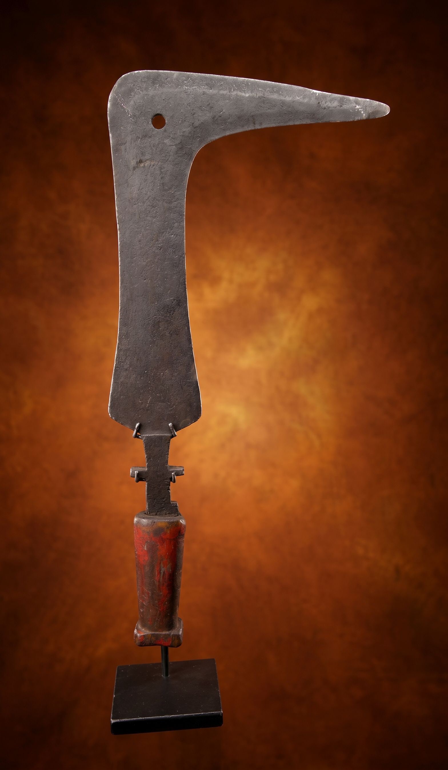 A Mangbetu Knife: A fine old carved wood and steel knife known locally as a trumbash or sickle knife. This example was reportedly collected in Kinshasa , Congo, Africa in 1961 by the consignors family. The Knife measur