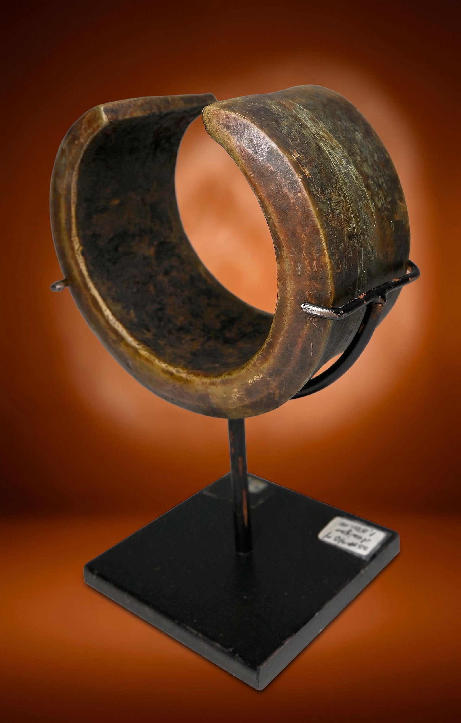 Antique Mongo Currency Anklet: This is an antique Konda or Currency form, in the shape of a semi circular anklet that could have been worn as well. This example is unusual as it also has incised linear designs and an old label stat