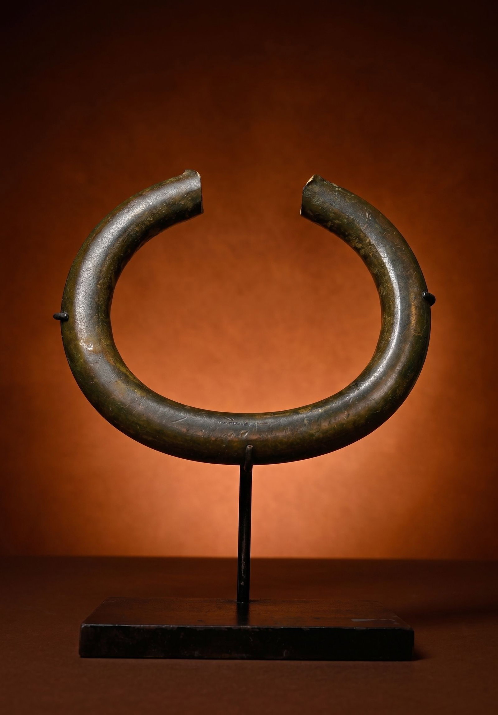 A Perfect Old Jonga Currency Form: This is a very heavy and thick antique currency form, in the shape of an neck collar or possibly an anklet that could have been worn as well. The use of imported copper alloy manillas as currency or u