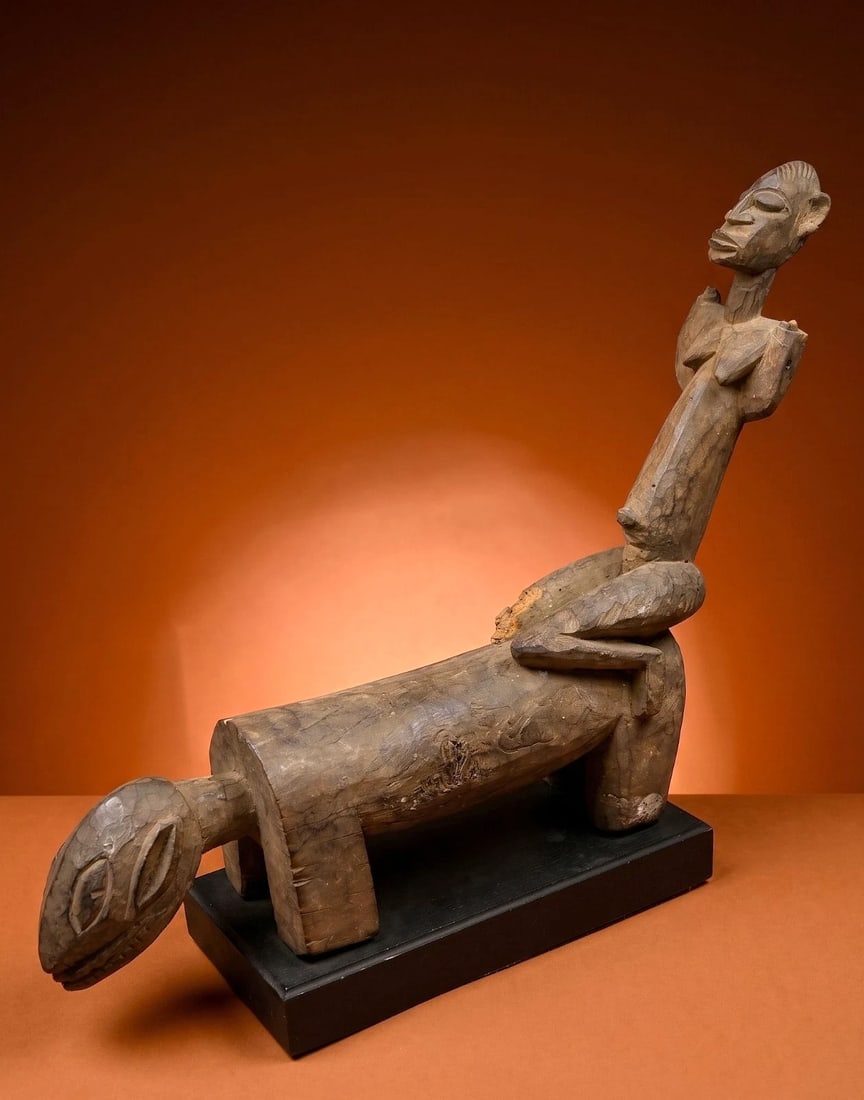 A Dogon Nommo on Horseback Sculpture: A sculpture of a vintage to contemporary male Nommo ancestor shown on horseback with arms in the air (now eroded and lost) as a form of prayer for rain. Dogon peoples, Mali, West Africa. The sculpture