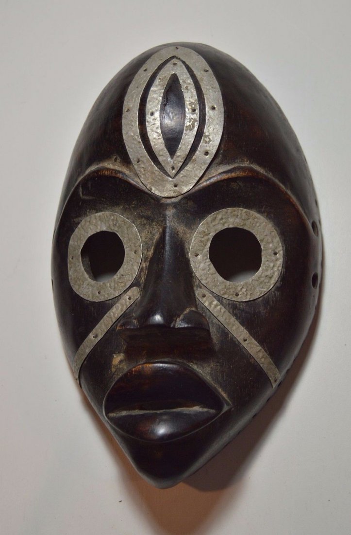 DAN Poro Secret Society Mask, African Tribal Art: This is a wonderful older wooden mask from the Dan peoples of Cote d'ivoire West Africa.Carved wood with fantastic metal adornment, with a well handled patina. A classic example, note the near perfect