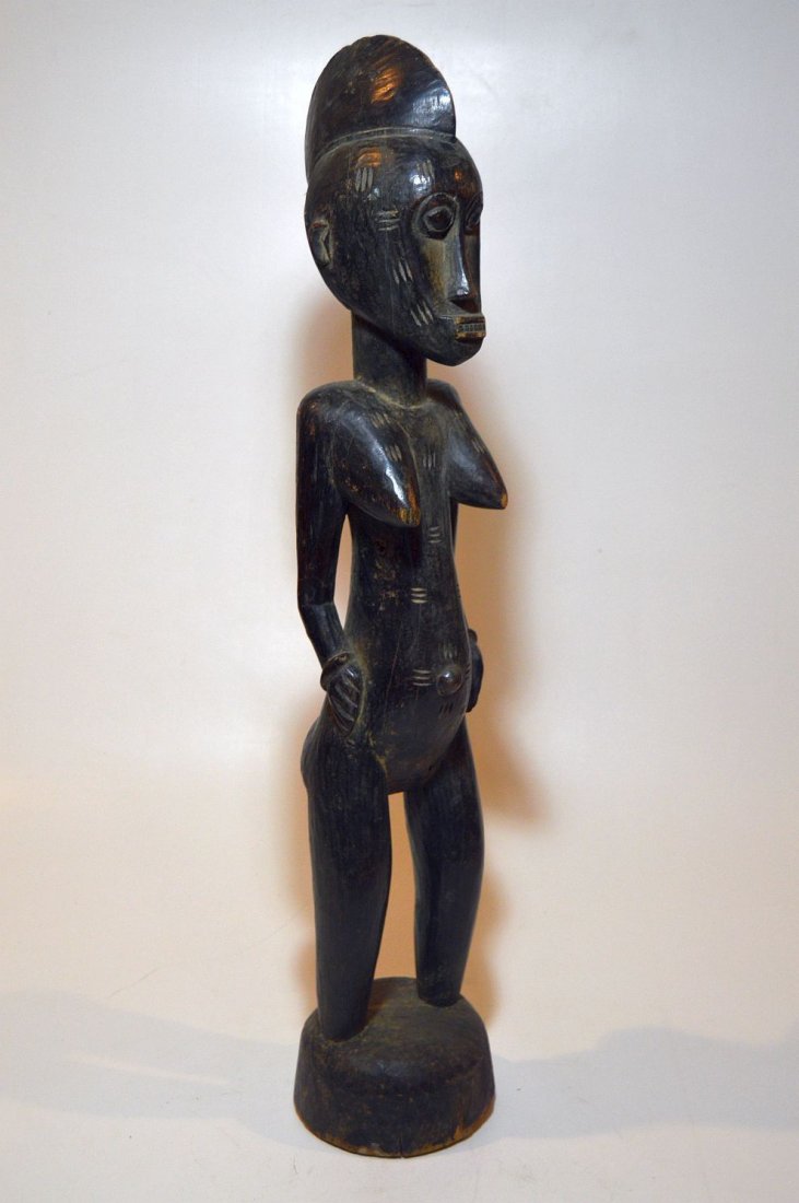 Vintage Senufo female sculpture, African Tribal Art: This is a very nice Old Senufo female sculpture, Known as Deble, from Mali, Africa,Carved wood with well worn deep patina , obvious age and handling. Measures 31 inches tall.