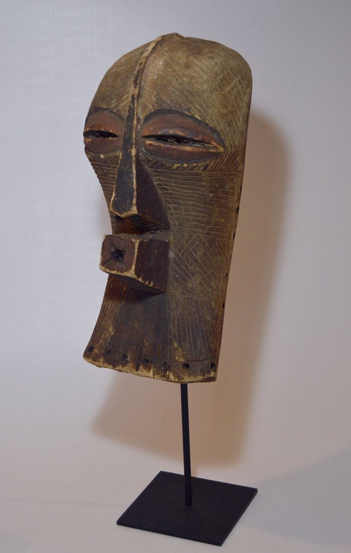Fine Old Songye Kifwebe Society African mask: This is a wonderful older wooden mask from the Songye peoples of The DRC / Congo, central Africa.Carved wood with a well handled and weathered patina. An unusual example that appears to have field use