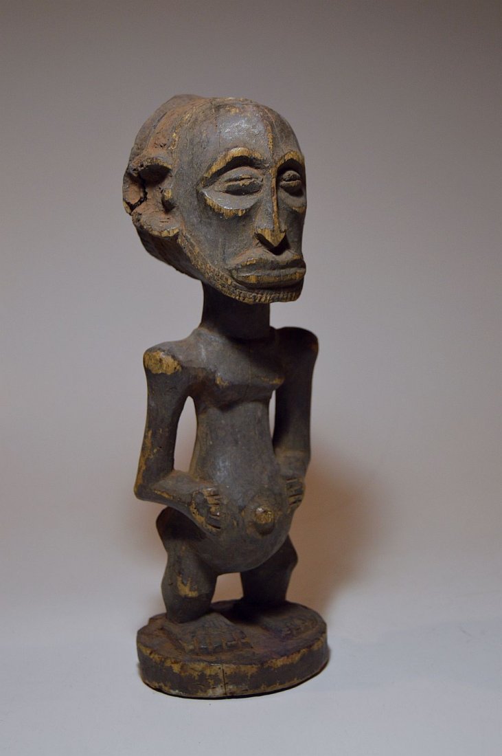 Old Hemba Male sculpture, African Tribal Art: This is a very fine vintage wood sculpture from the Hemba peoples, Central Africa. Carved from a single piece of wood with an undeniable well weathered patina from handling over many years. The Statue