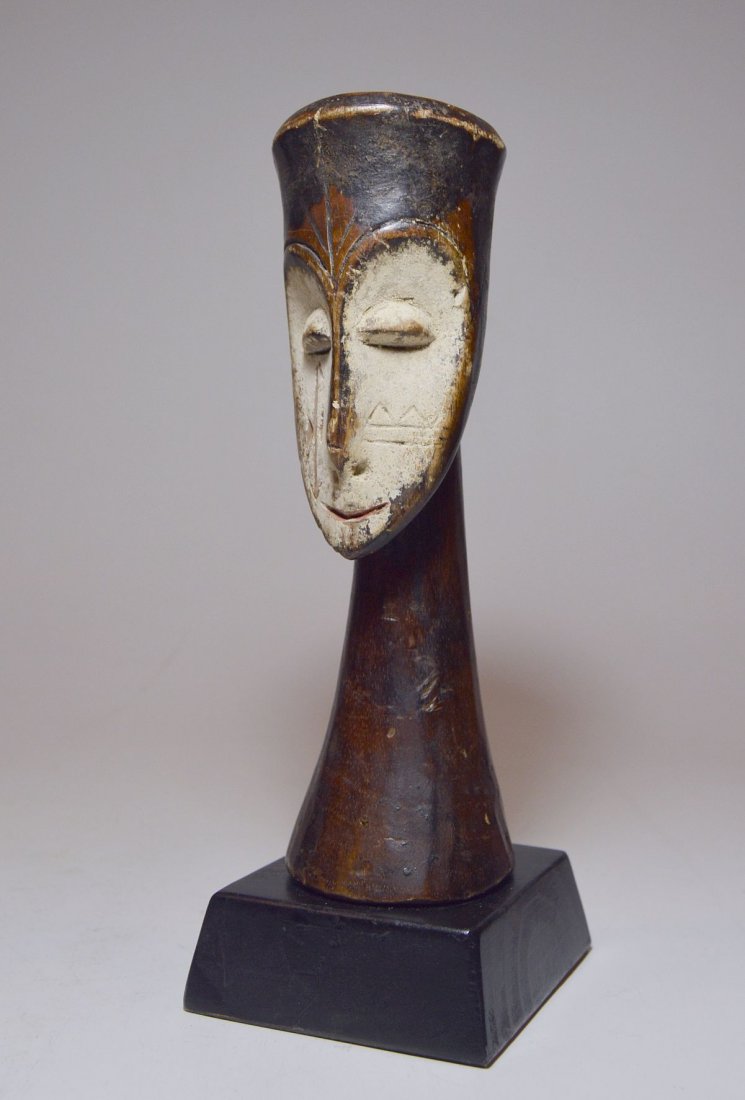 A Gorgeous Old Fang sculpture, African Art: This is a very finely carved old wooden bust or sculpture from the Fang peoples of Gabon, West Africa. The masterfully crafted figure features a Ngil type mask face on a scepter like form. the Style, 