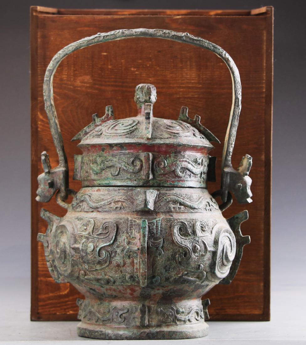 Chinese Zhou Styled Bronze Wine Container Carved with: Chinese Zhou Styled Bronze Wine Container Carved with Taotie W:22cm H:34cm