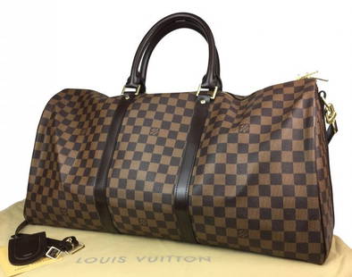 LOUIS VUITTON Damier Ebene Keepall Bandouliere 55: Louis Vuitton large duffel bag is crafted of signature Louis Vuitton Damier checkered canvas in Ebene brown. Features dark brown cowhide leather rolled top handles, an optional adjustable shoulder str