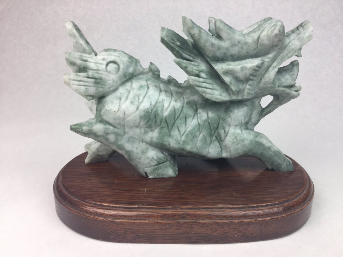 JADE Foo Dragon: Chinese Jade Foo Dog. Mounted on wood stand. Measures Approx: 6 1/2" x 8 1/2".