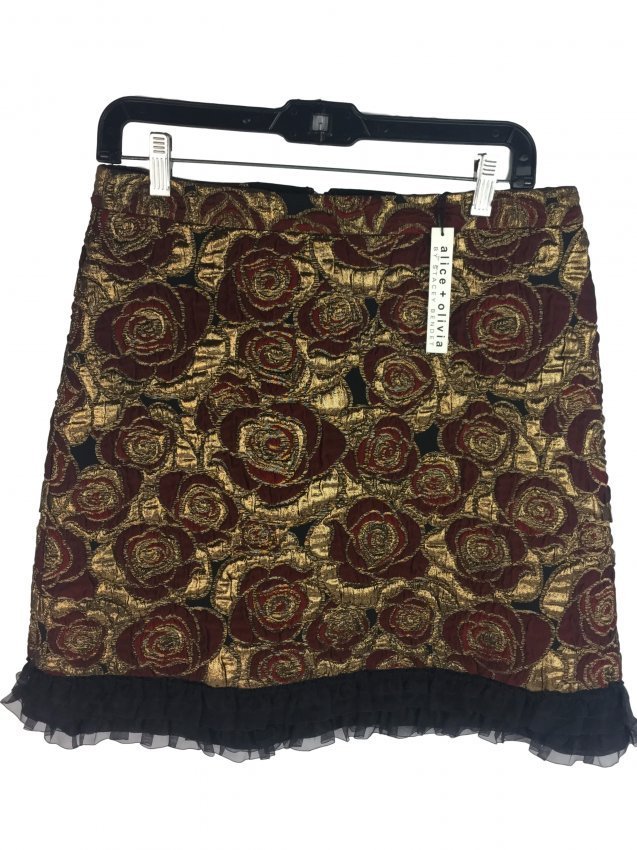 ALICE + OLIVIA Floral Skirt: Very stylish red and gold floral skirt by ALICE + OLIVIA. Black ruffled bottom. Zipper back. Size: 10. Measurements approx. 51cm x 39cm.