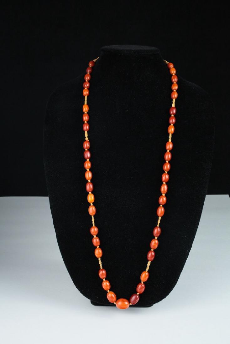 A butterscotch amber bead necklace, (1 of 7)