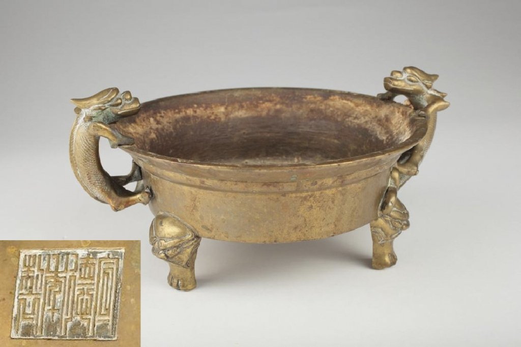 A Chinese bronze dragon-handled tripod censer, (1 of 10)