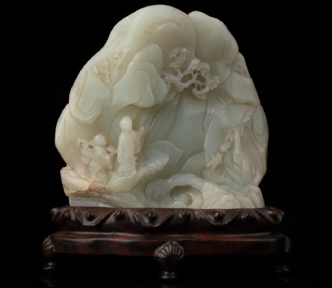 A pale celadon jade boulder carving, Qing dynasty, (1 of 9)