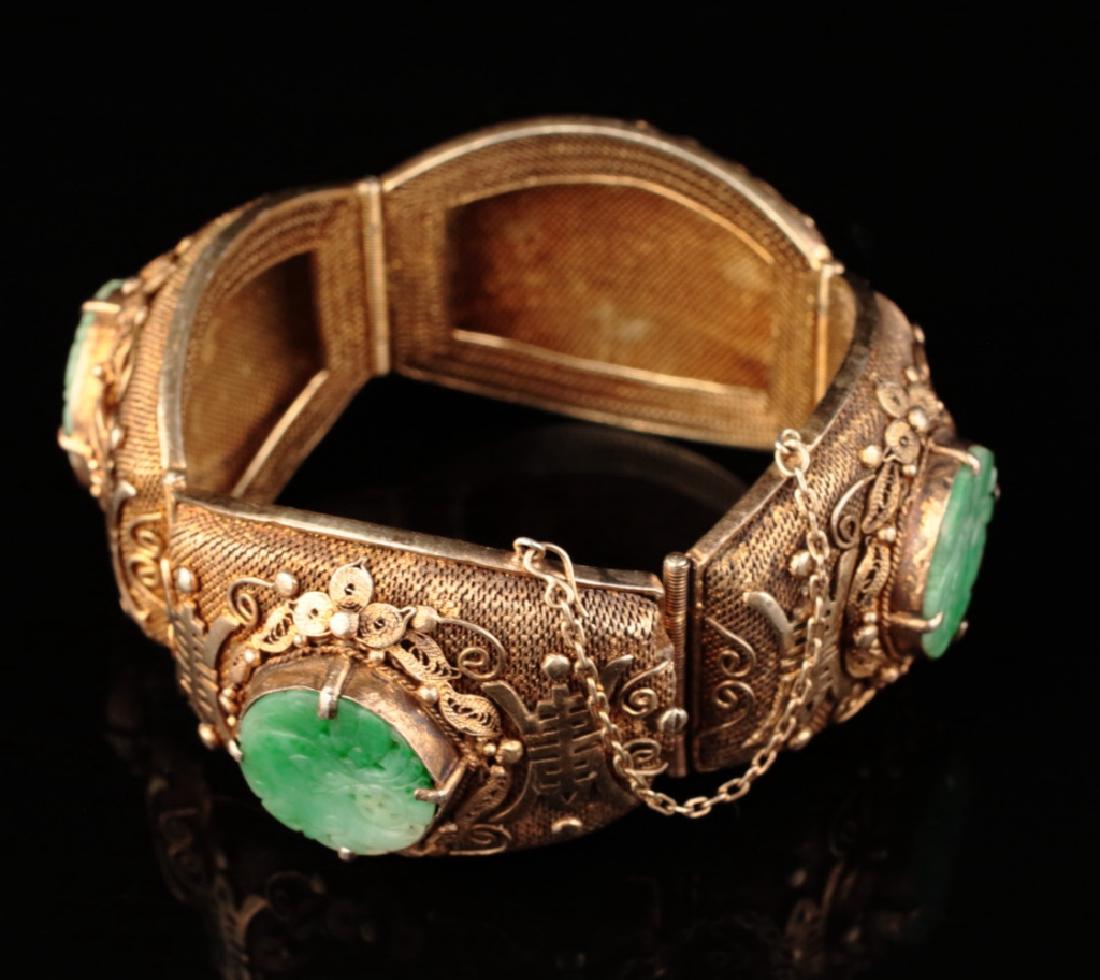 A heavy silver gilt mounted jadeite bracelet, (1 of 10)
