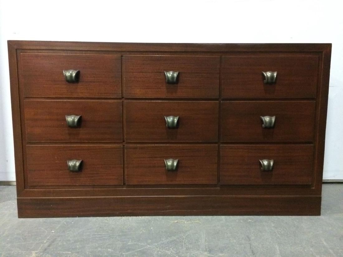 Paul Laszlo Credenza -- Mid Century Interior Design: This lot consists of the Paul Laszlo credenza shown in the corresponding images. This stately mahogany dresser has nine drawers, each of which has a mixed-metal drawer pull. The drawers are dovetail j