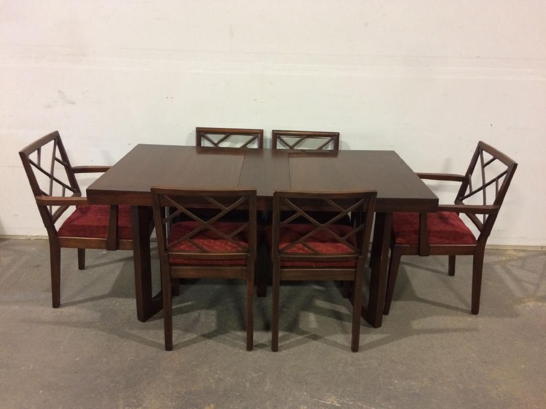 Paul Laszlo Dining Room Set, Table and Six Chairs: This lot consists of the classic Paul Laszlo dining table and rare set of six matching dining room chairs. The table and chairs are all of mahogany, with chairs upholstered in red embroidered fabric.