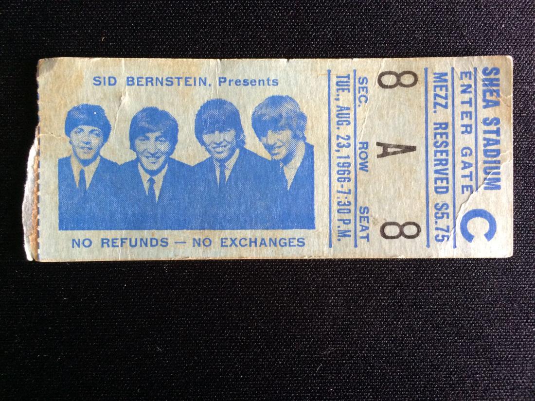 Beatles Shea Stadium Concert Ticket Stub, 1966, Vintage: In this lot is a ticket stub from the Beatles' second appearance at Shea Stadium, on August 23rd, 1966. The paper on which the ticket is printed is a light blue-green color, with blue print stating 'S