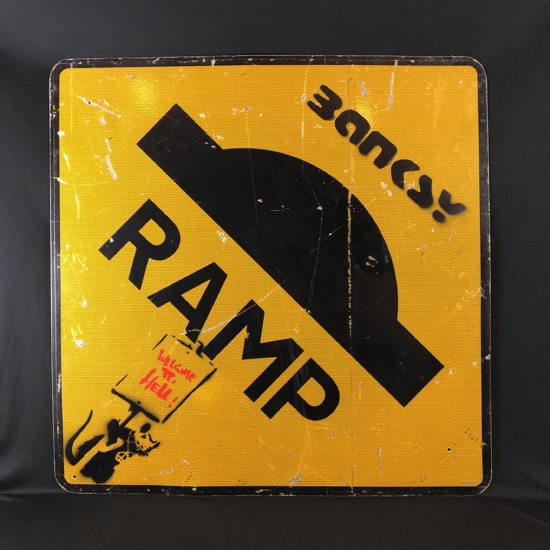 Banksy (1974- ) -- Hand Stenciled Painting - style of: This lot consists of a hand-stenciled aerosol painting on a reclaimed Metal European road sign, with "Banksy" hand stenciled in black spray paint at top. Image depicts a hand stenciled and spray paint