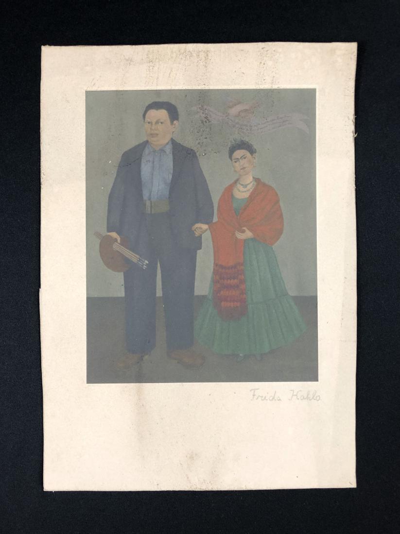 Frida Kahlo (1886-1957) Hand Inscribed Fine Art Print: This lot consists of a fine art print on paper, with "Frida Kahlo" handwritten in graphite at bottom of composition. Image depicts the artist Frida Kahlo (Mexican, 1907-1954) and her husband, Diego Ri