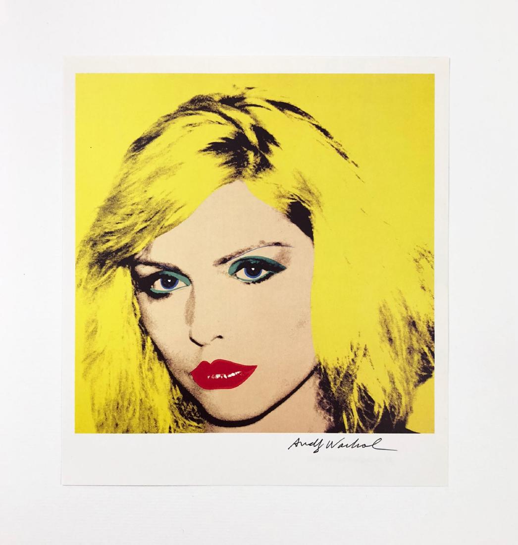 In the style of Andy Warhol-- Fine: This lot consists of a fine art print on paper, "Andy Warhol" at bottom center. A central image portrays American New Wave musician Debbie Harry (1945-) (Blondie) in ultimate Warhol fashion. Done with