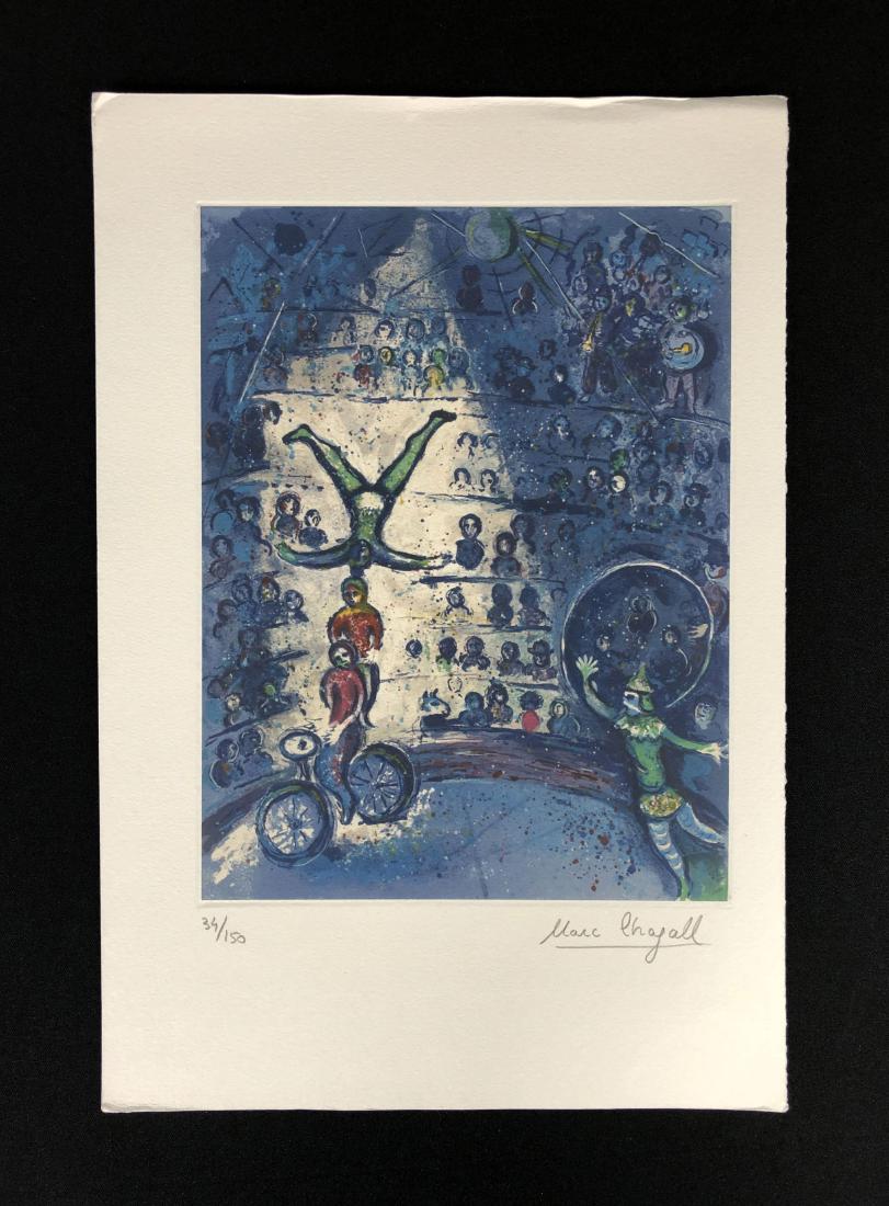 In the style of Marc Chagall-- Fine Art Print --: This lot consists of a fine art print on paper, "Marc Chagall" and hand-numbered "34/150" in graphite at bottom of composition. This dreamy image depicts a circus in tones of blue and green. Performer