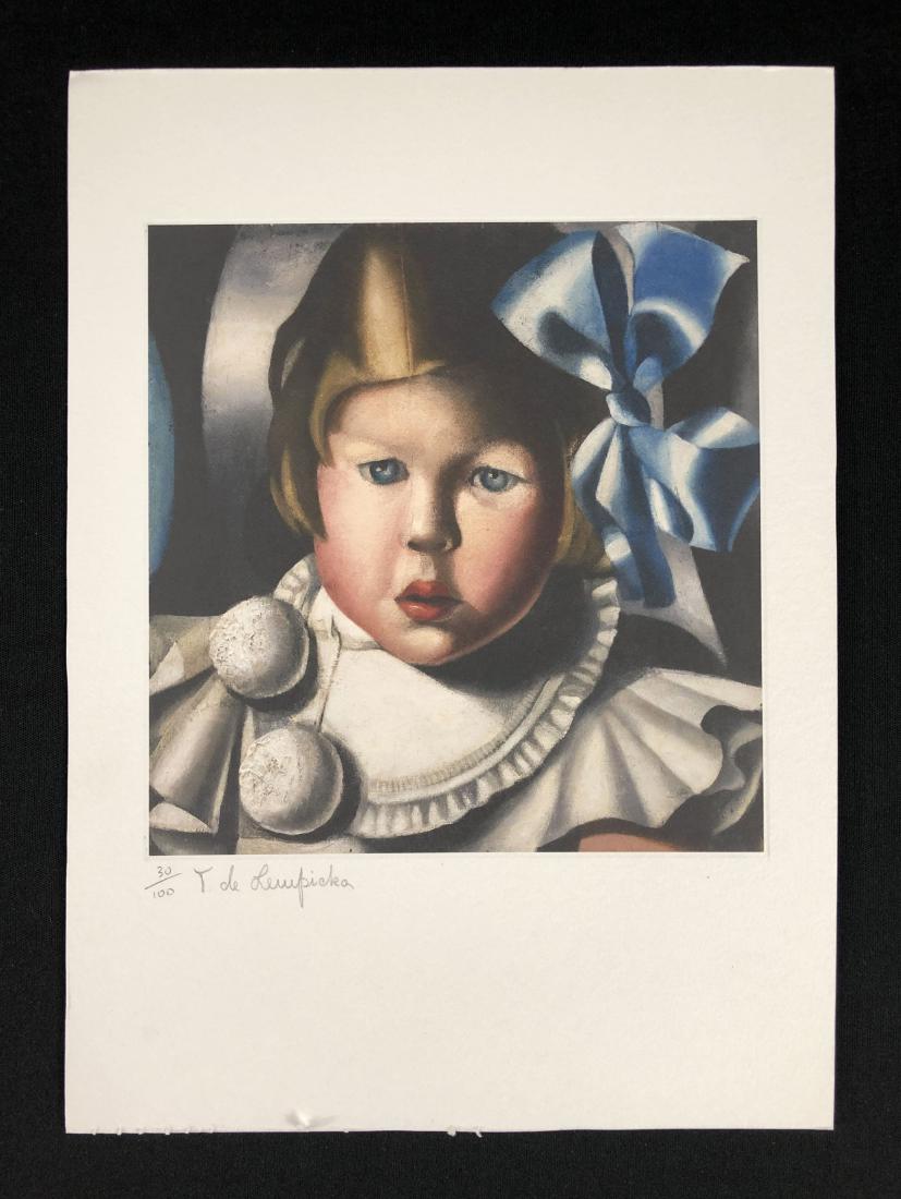 In the style of Tamara de Lempicka--: This lot consists of a fine art print on paper, "T. de Lempicka" and numbered "30/100" in graphite at lower left. Image depicts a golden-haired young girl with a large blue bow and a ruffled white dre
